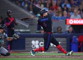 George Springer of the Blue Jays hits a solo home run in the fifth inning against the Seattle Mariners at Rogers Centre in Toronto, Friday, Aug. 28, 2026.