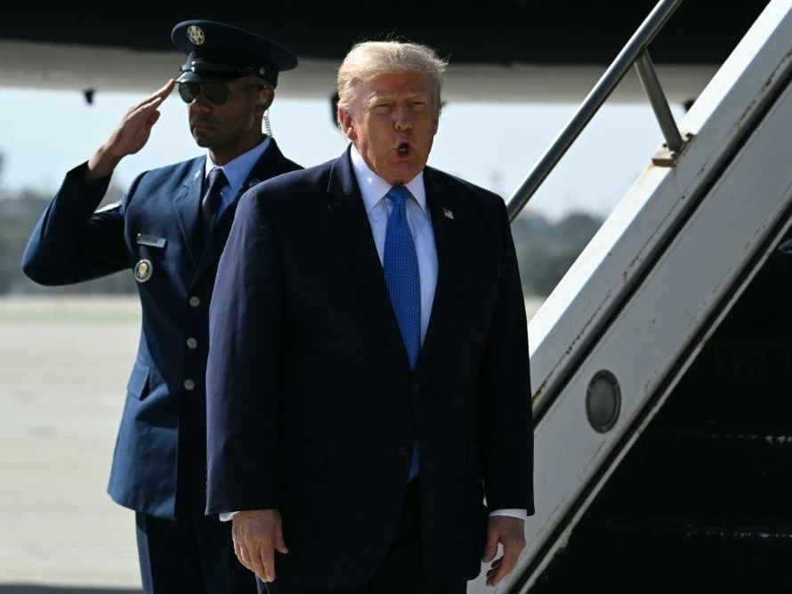 U.S. President Donald Trump reacts after stepping off Air Force One upon arrival at Los Angeles International Airport in Los Angeles. (Jim WATSON/AFP)