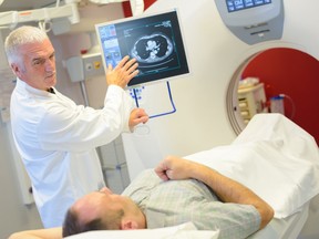Man having scan, doctor discussing results