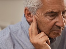 Senior man with hearing problems
