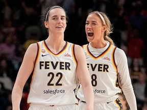 Caitlin Clark #22 of the Indiana Fever celebrates with Sophie Cunningham #8 after scoring the game-winning three pointer during the second half against the Washington Mystics at CareFirst Arena on June 08, 2026 in Washington, DC.