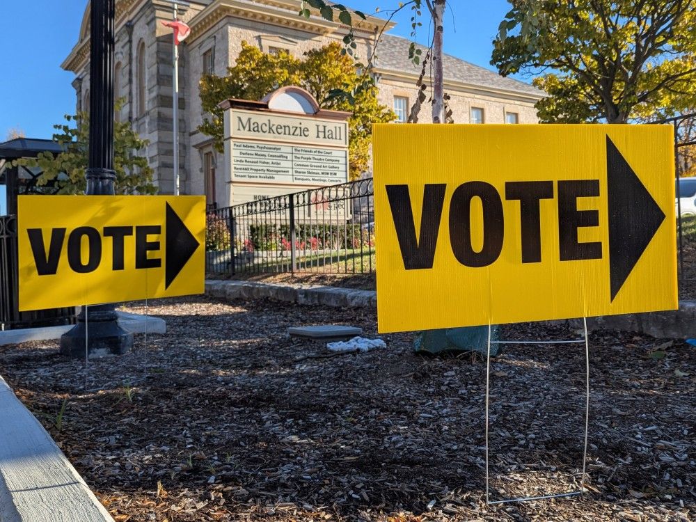 Voting signs are pictured in Windsor, Oct. 27, 2025.