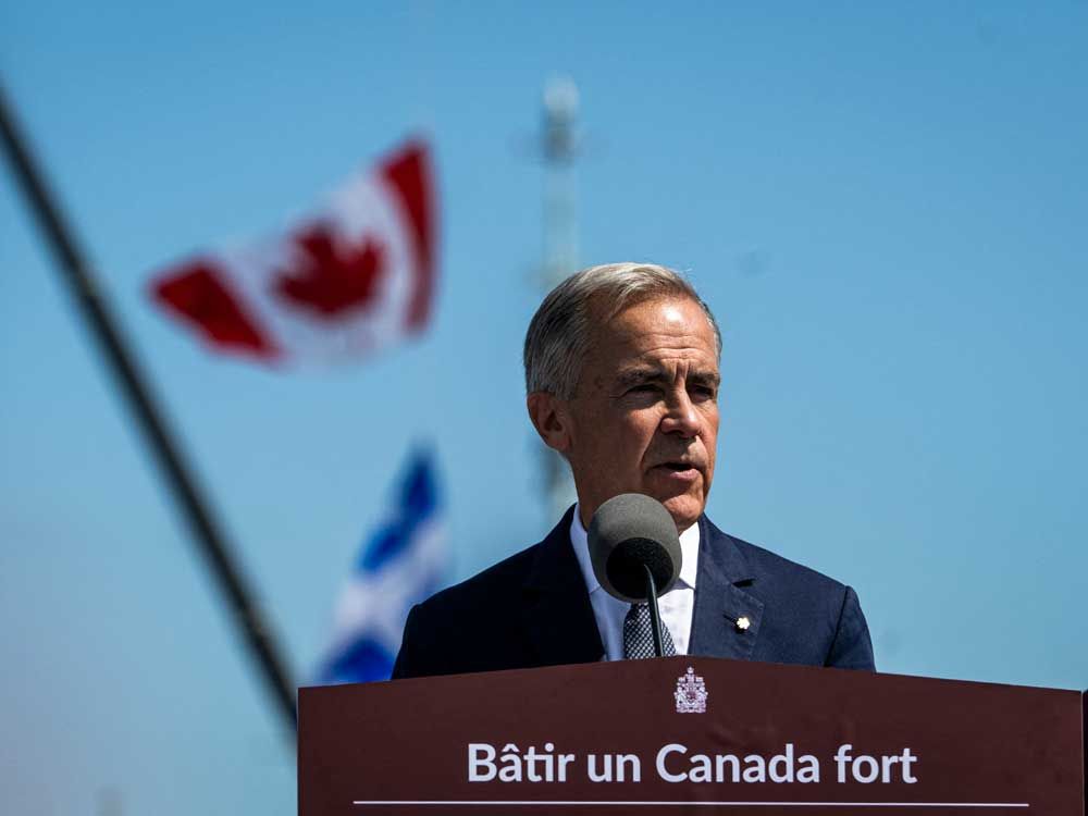 Prime Minister Mark Carney speaks about the trade dispute with the United States at the Davie Shipyard in Levis, Que., on Aug. 24, 2026. 