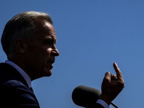 Canadian Prime Minister Mark Carney speaks about the trade dispute with the United States at the Davie Shipyard in Levis, Quebec, Canada on August 24, 2026.