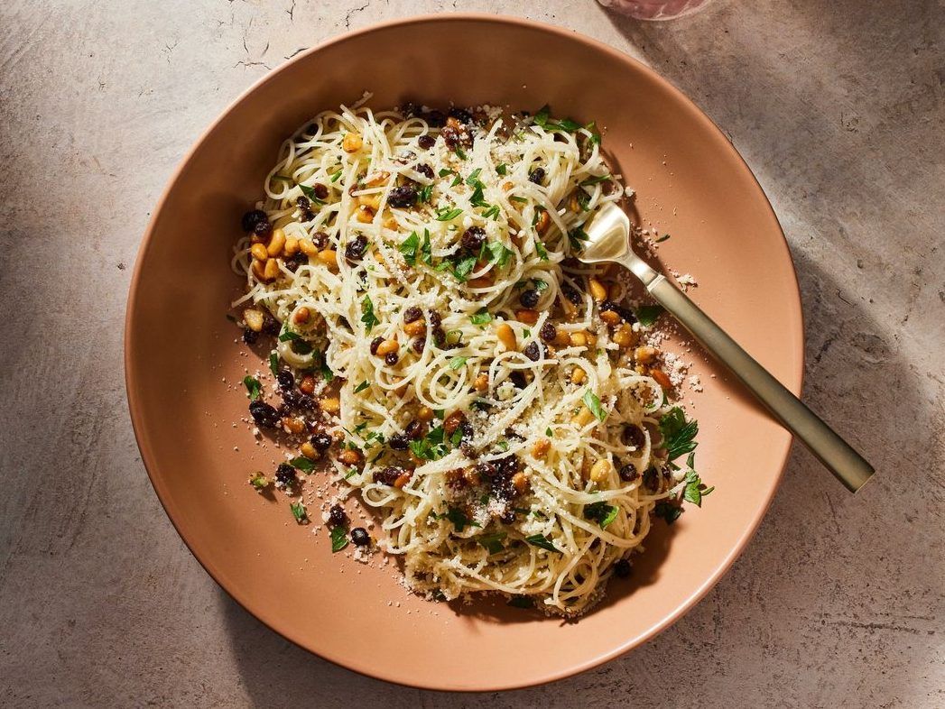 Angel Hair Pasta With Currants and Pine Nuts. MUST CREDIT: Justin Tsucalas/For The Washington Post; food styling by Lisa Cherkasky
