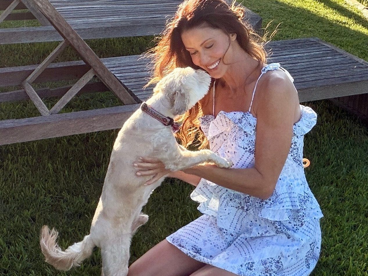 Shannon Elizabeth playing with her dog Cooper.
