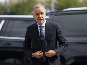 Prime Minister Mark Carney speaks to journalists outside his office, the day after the Liberals won three byelections, in Ottawa on Tuesday, Sept. 1, 2026.