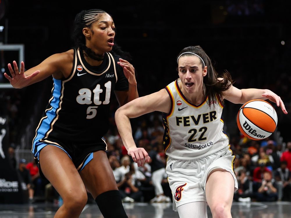 Caitlin Clark of the Indiana Fever drives to the basket against Angel Reese of the Atlanta Dream during a game earlier this season.