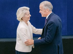 European Commission President Ursula von der Leyen (left) shaking hands with Canada's PM Carney