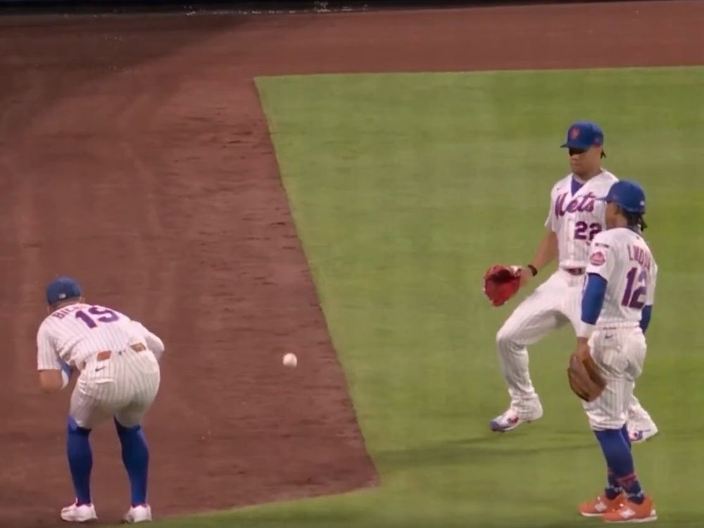 New York Mets' Bo Bichette, Juan Soto and Francisco Lindor miss a pop fly against the Baltimore Orioles.
