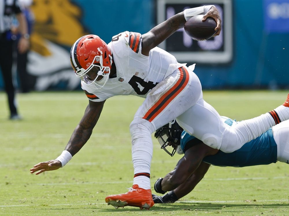 Deshaun Watson of the Cleveland Browns is tackled by Ventrell Miller of the Jacksonville Jaguars.