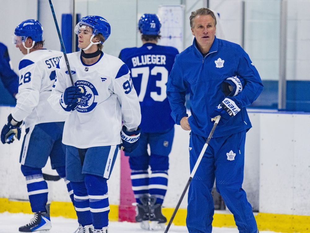 Coach Jim Hiller and Gavin McKenna at Toronto Maple Leafs training camp.