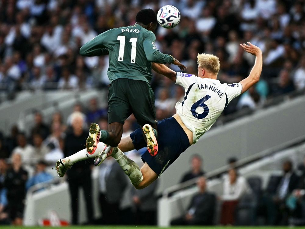 Everton's Thierno Barry jumps up for the ball with Tottenham Hotspur's Jan Paul van Hecke during their English Premier League football match.