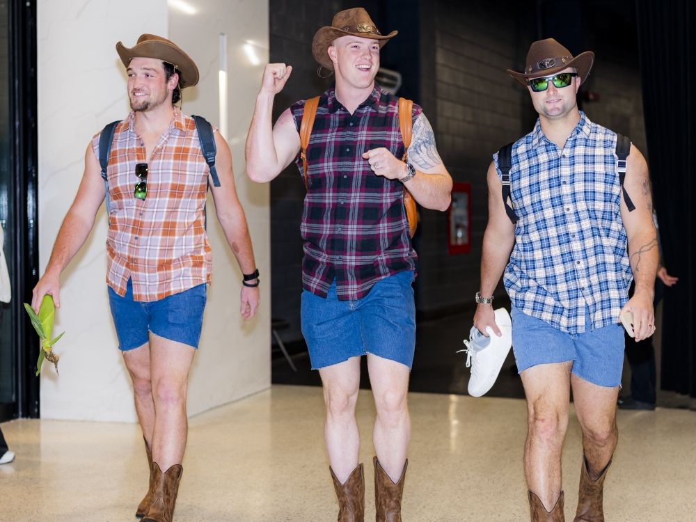 Toronto Blue Jays' rookies wear cowboy outfits while heading to the airport.