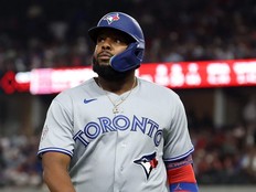 Vladimir Guerrero Jr. walks back to the dugout