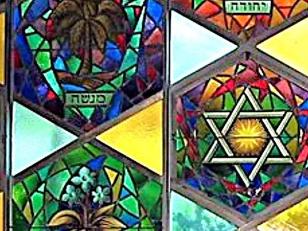 A Sons of Jacob Synagogue photo shows stained glass