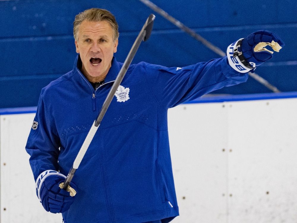 Toronto Maple Leafs head coach Jim Hiller gives instructions at training camp in Etobicoke.
