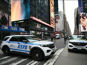New York City Police secure the area where an officer-involved shooting left one dead near Times Square.