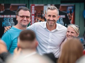 Ulrich Siegmund, centre, far-right Alternative for Germany (AfD)'s main candidate in the Saxony-Anhalt state election, poses for photos with supporters at an election campaign event in Haldensleben, eastern Germany, on Sept. 1, 2026.