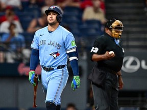 George Springer of the Toronto Blue Jays reacts after striking out.