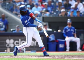 Charles McAdoo of the Toronto Blue Jays hits a single.