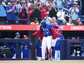 Vladimir Guerrero Jr. of the Toronto Blue Jays receives the Blue Jays home run jacket.