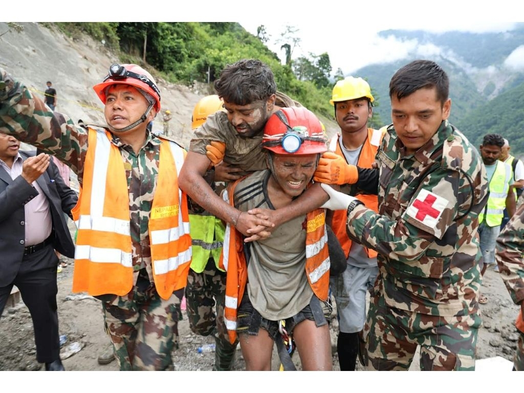 Two hydropower workers have been pulled alive from a tunnel 10 days after it was buried by debris in Nepal. (Handout/NEPAL ARMY/AFP)