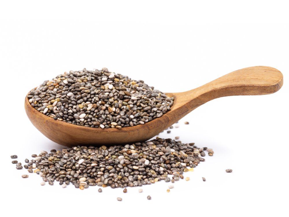 chia seeds in wooden spoon Isolated on white background