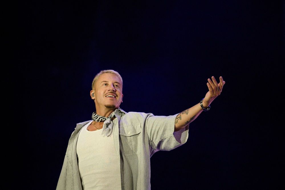 US rapper, singer, dancer and DJ, Benjamin Haggerty, known as Macklemore, performs at the Goldencoast Rap Festival in Corcelles-les-Monts, near Dijon, central-eastern France, on August 30, 2026. 
