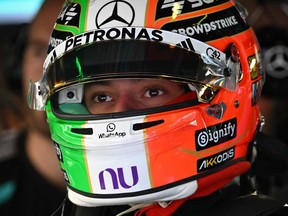 Mercedes' Italian driver Kimi Antonelli wears his special helmet for the home race, to pay tribute to MotoGP legend Valentino Rossi, in the pits during the first practice session of the Italian Formula One Grand Prix at the Autodromo Nazionale Monza circuit in Monza, northern Italy, on Sept. 4, 2026.