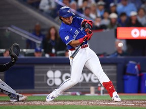 Blue Jays' Kazuma Okamoto hits a 3-run home run in the seventh inning during a game against the Detroit Tigers at Rogers Centre on Monday.