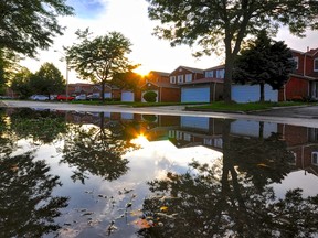 A flooded street in a Toronto residential neighbourhood.