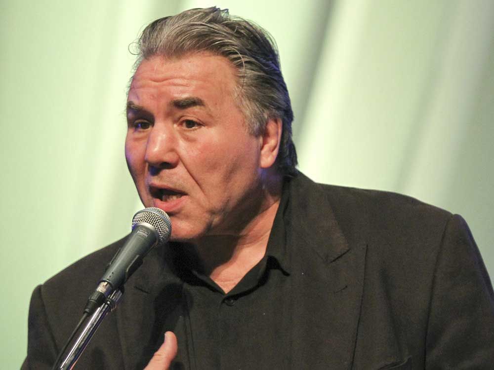 In this undated file photo, retired Canadian heavyweight boxer George Chuvalo speaks at the Moncton Wesleyan Celebration Centre on his fight against drugs in Moncton, N.B.