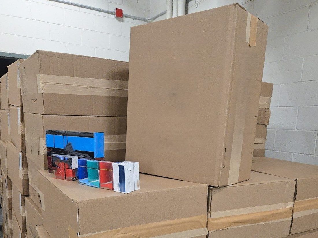 Man allegedly caught with 650,000 unmarked cigarettes; pair charged as gun and drugs seized