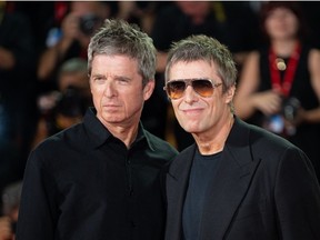 Noel Gallagher and Liam Gallagher attend the red carpet of the movie Oasis Dont Look Back in Anger during the 83rd Venice International Film Festival.