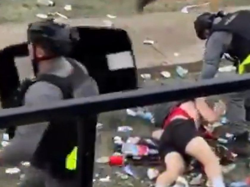 Police deal with rioters recently near the University of Guelph during homecoming weekend.
