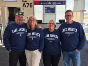 Two men, two women wearing AI-generated "Lake America" sweatshirts