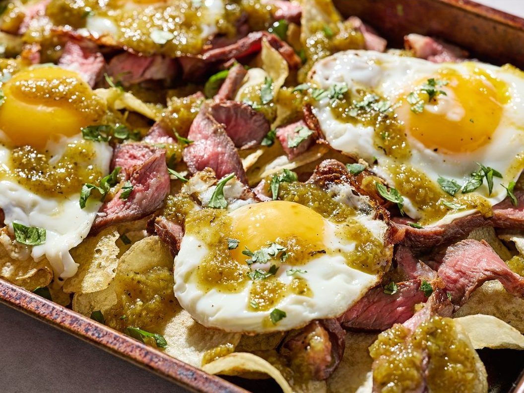 Potato chips get the nacho treatment in this steak-and-eggs dinner