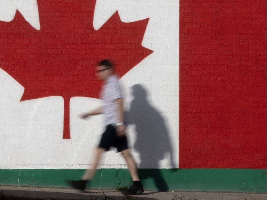 A person walks past a Canadian flag mural in Port Credit,, Ontario, Tuesday September 8, 2026.
[Photo By Peter J Thompson/National Post][For National Post Story by TBA/National Post]