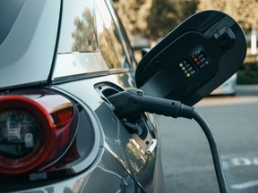 A plug-in-electric vehicle being charged.