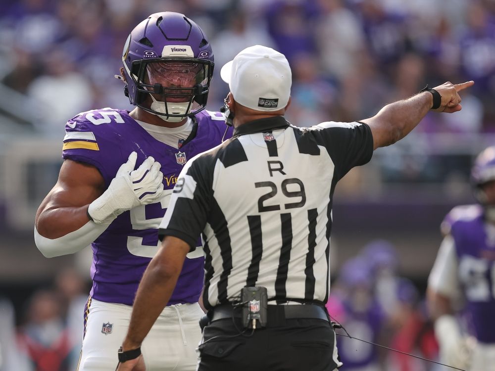 Minnesota Vikings linebacker Eric Wilson talks with referee Adrian Hill after an incident during Sunday’s game against the Miami Dolphins.