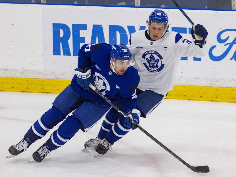 Nick Paul (left) and Ben Danford compete during Toronto Maple Leafs training camp.