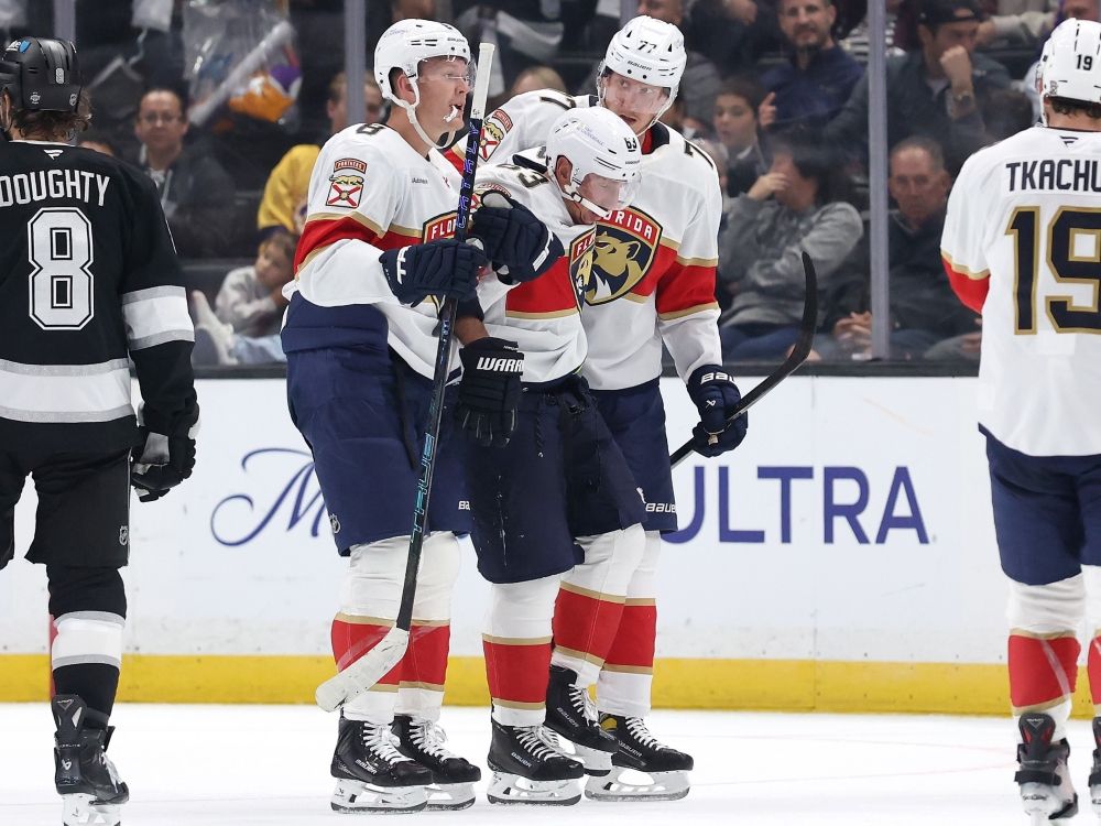 Brad Marchand of the Florida Panthers is helped off the ice with an injury against the Los Angeles Kings.