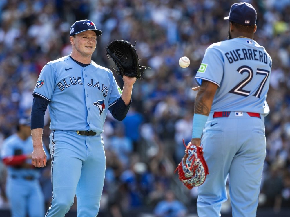 Louis Varland and Vladimir Guerrero Jr. of the Toronto Blue Jays celebrate a win over the Baltimore Orioles earlier this season.