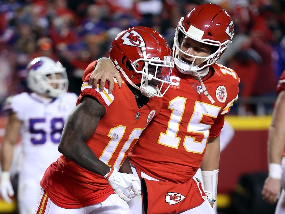 Patrick Mahomes of the Kansas City Chiefs celebrates a touchdown with Tyreek Hill during a playoff game in 2022.