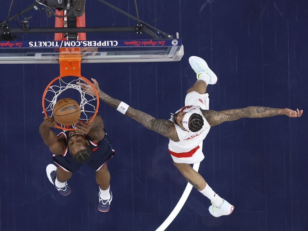 Kawhi Leonard of the Los Angeles Clippers makes a slam dunk against Brandon Ingram of the Toronto Raptors during a game last season. The pair were involved in a trade for each other this off-season.