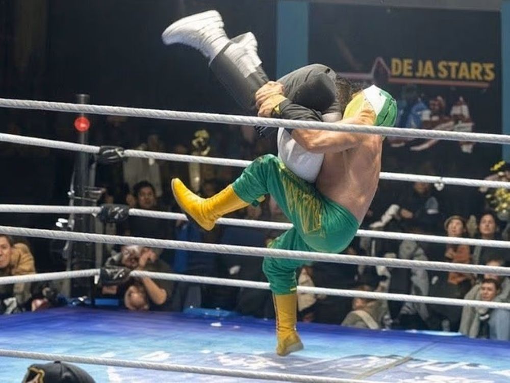 Mexican luchador Hijo De Fishman performs a piledriver on referee Gerardo German Pineda.