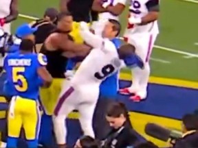 Los Angeles Rams' Alaric Johnson hits Buffalo Bills' Bradley Chubb after Monday's game.