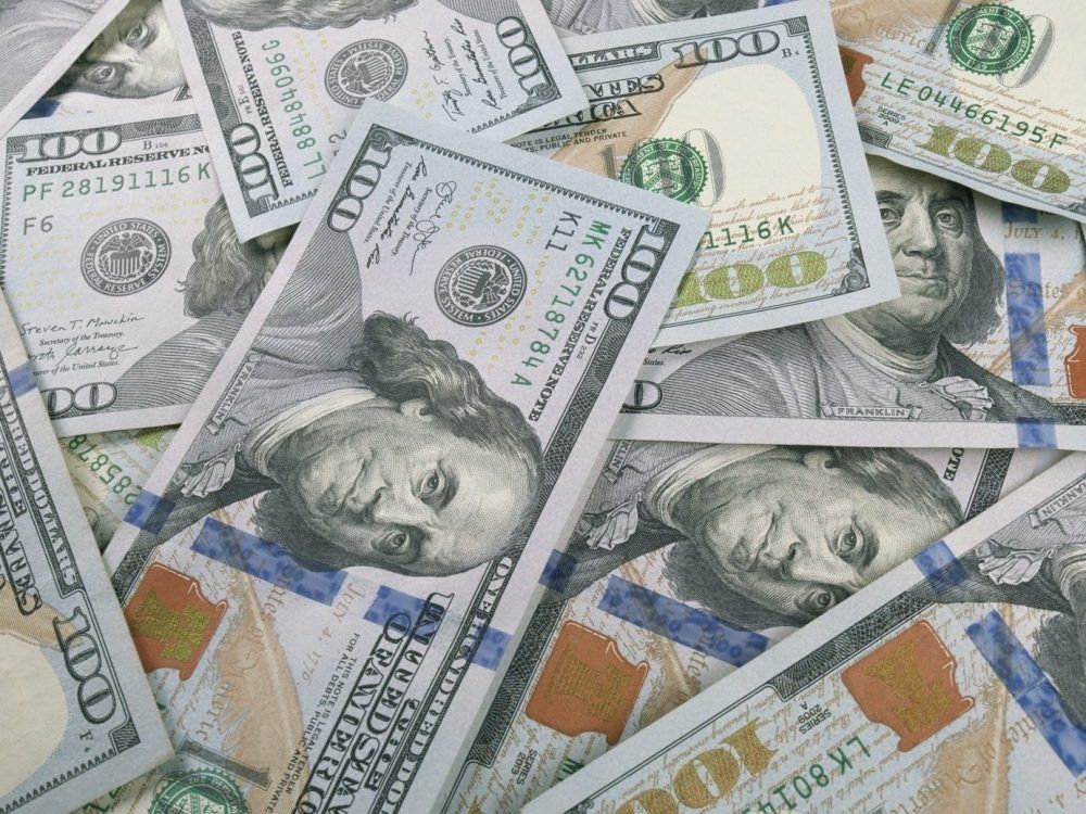 An up-close view displaying scattered U.S. currency