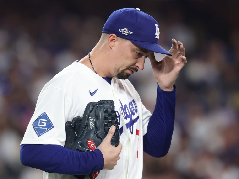 Blake Snell of the Los Angeles Dodgers walks off the field during the seventh inning against the Milwaukee Brewers.